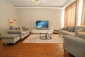 Comfort Apartment, Courtyard View | Living area - 2BR Fully Serviced Apt. in AeonTowers (6th of October City)