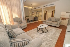 Comfort Apartment, Courtyard View | Living area - 2BR Fully Serviced Apt. in AeonTowers (6th of October City)