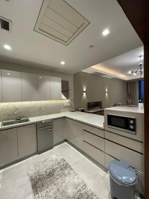 Comfort Apartment, Courtyard View | Private kitchen - 2BR Fully Serviced Apt. in AeonTowers (6th of October City)