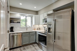 Fridge, microwave, oven, stovetop - Fully updated condo with serene view, enclosed balcony, WiFi, W/D, pool, & gym (Seabrook Island)