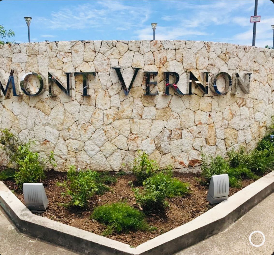 A stone wall with the words "MONT VERNON" in large letters.