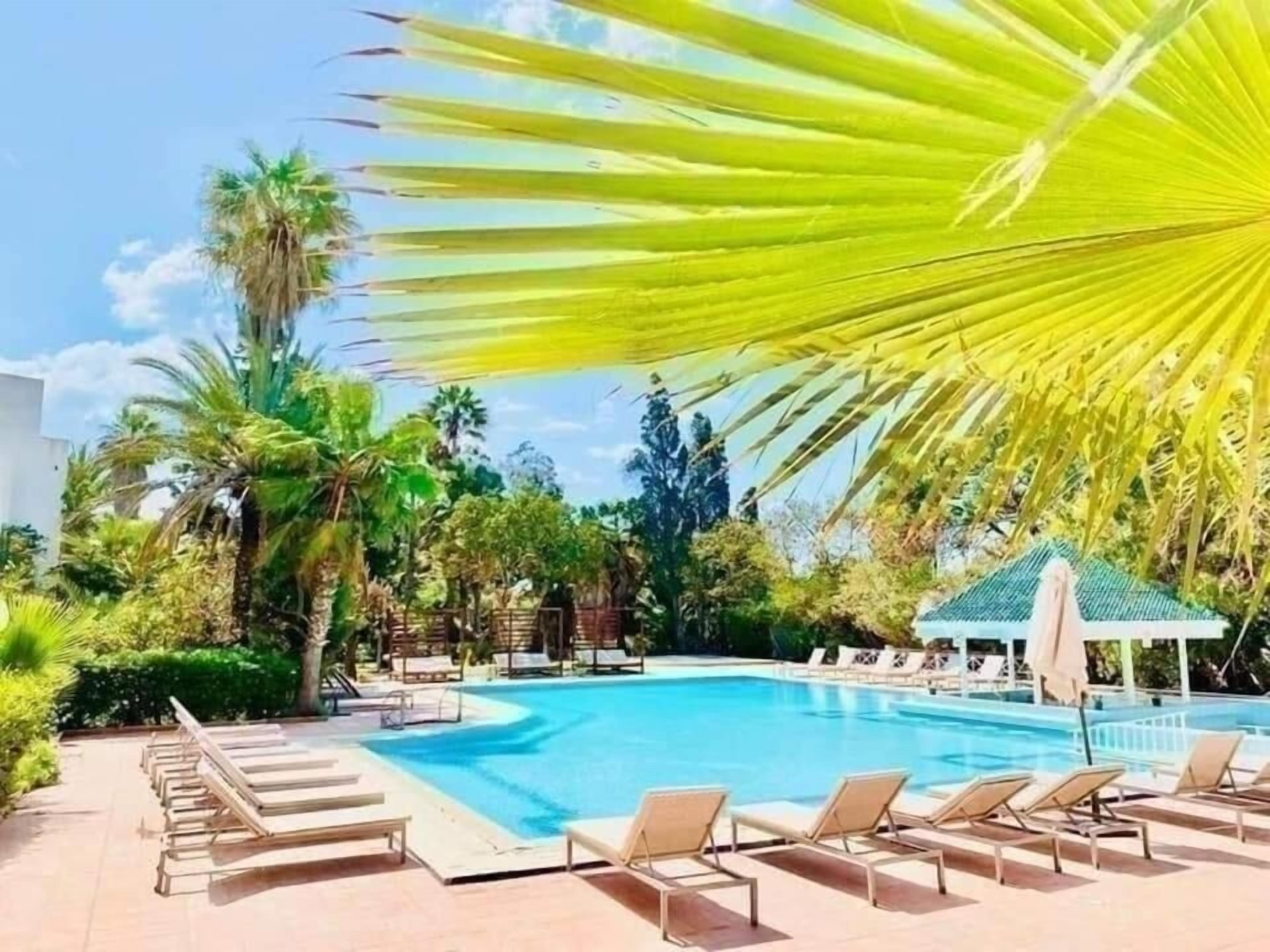 Indoor pool, seasonal outdoor pool, pool umbrellas, pool loungers