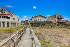 Exterior - Oceanfront home with WiFi, full kitchen, & deck that spans the side of the home (Folly Beach)