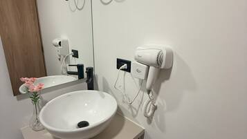 Shower, towels, soap, toilet paper