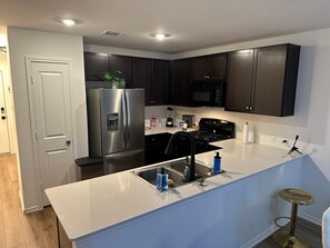 Microwave, oven, stovetop, dishwasher - Cozy Hideaway with Pool – Relax & Unwind Just Off the Highway (Maxwell)