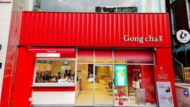 A red storefront with the name "Gong cha" and a sign indicating "PICK UP + GO".