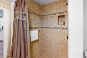 Shower, hair dryer, towels, shampoo