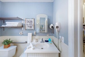 Shower, hair dryer, towels