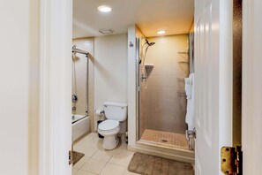 Shower, hair dryer, towels, shampoo