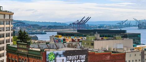 A cityscape with a prominent advertisement for Space Dust IPA beer.