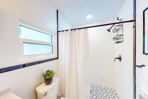 Shower, hair dryer, towels, shampoo