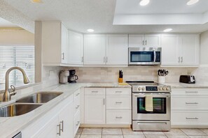 Fridge, microwave, oven, stovetop - Sand Castle condo with Gulf view balcony heated pool hot tub and beach access (Indian Rocks Beach)