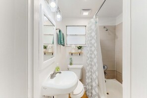 Shower, hair dryer, towels, shampoo