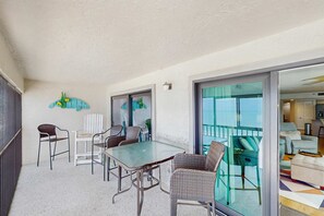 Outdoor dining - Beautiful corner condo with ample balcony beach views WD heated pool pool spa (Madeira Beach)