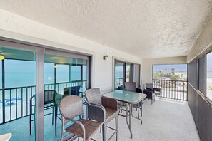 Outdoor dining - Beautiful corner condo with ample balcony beach views WD heated pool pool spa (Madeira Beach)