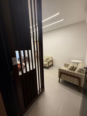 Deluxe Apartment, Beach View | Living area | 50-inch Smart TV with digital channels, Netflix, streaming services