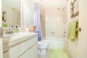 Shower, hair dryer, towels, shampoo