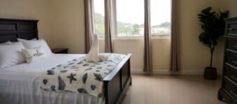 Relaxing modern 1-bedroom condo with pool in a gated Portmore Community.