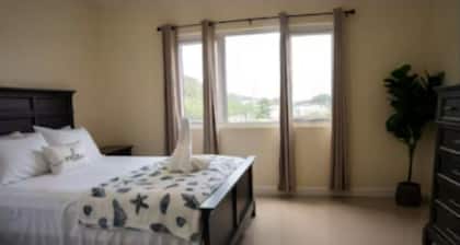 Relaxing modern 1-bedroom condo with pool in a gated Portmore Community.