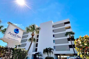 A modern hotel building with a sign for ArieDam Resort at 14600 Gulf Boulevard. - Beautiful oceanfront condo in Madeira Beach w balcony and pool (Madeira Beach)
