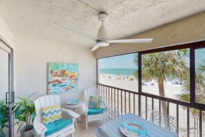 Outdoor dining - Beautiful oceanfront condo in Madeira Beach w balcony and pool (Madeira Beach)