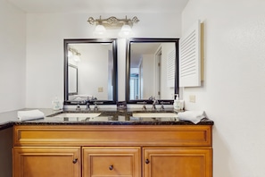 Shower, hair dryer, towels, shampoo