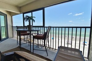 Outdoor dining - Peaceful beachfront escape w/private balcony, heated pool, pool spa, BBQ grills (Madeira Beach)