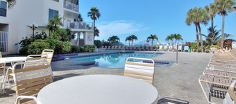 4th-floor beachfront corner condo with private balcony, views, heated pool, BBQ,