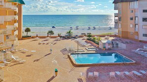 A resort with a pool, beach, and ocean view. - Charming condo with gorgeous Gulf views and beachfront heated pool and spa (Indian Shores)