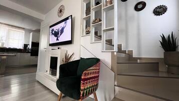 Comfort Villa, Courtyard View | Living area | 110-inch flat-screen TV with cable channels, TV