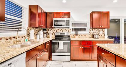 Dog-friendly tropical stay with a private pool, grill, game tables, & central AC