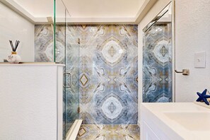 Shower, hair dryer, towels, shampoo