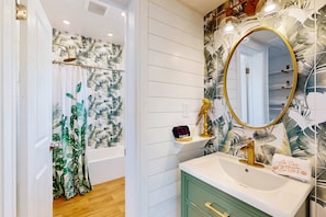 Shower, hair dryer, towels, shampoo