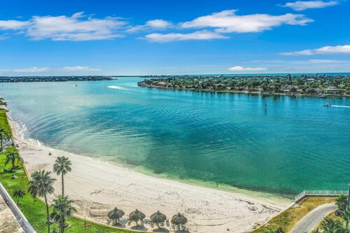 Water view condo with private beach pool and hot tub snowbird friendly