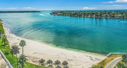 Water view condo with private beach pool and hot tub snowbird friendly