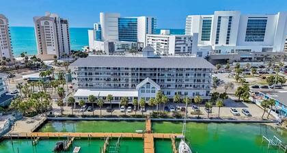 Steps to Gulf beaches family friendly condo with water views shared pool AC