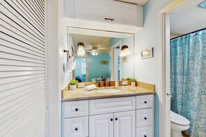 Shower, hair dryer, towels, shampoo
