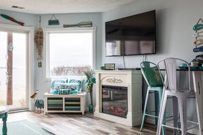 Smart TV, fireplace, books - Coastal Serenity 108 Beachfront Condo Near Downtown (Traverse City)