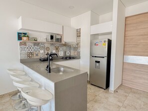 Apartment, 1 bedroom 1004VI | Private kitchen - Apartasuites Vita 945 - By Bedviajes (Santa Marta)