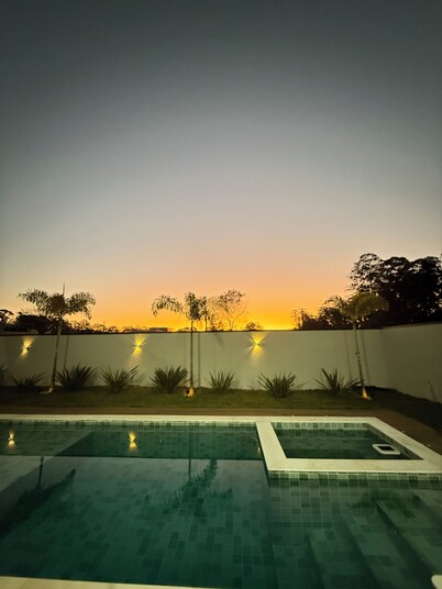 Single-story house with pool in a complete resort.