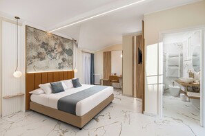 Deluxe Suite, Balcony, City View | In-room safe, blackout drapes, soundproofing, iron/ironing board