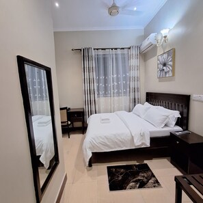 Comfort Double Room | Desk, laptop workspace, iron/ironing board, free WiFi - G.E.M ROYAL PALACE  (Dar es Salaam)