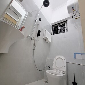 Comfort Double Room | Bathroom | Shower, slippers, towels, soap - G.E.M ROYAL PALACE  (Dar es Salaam)