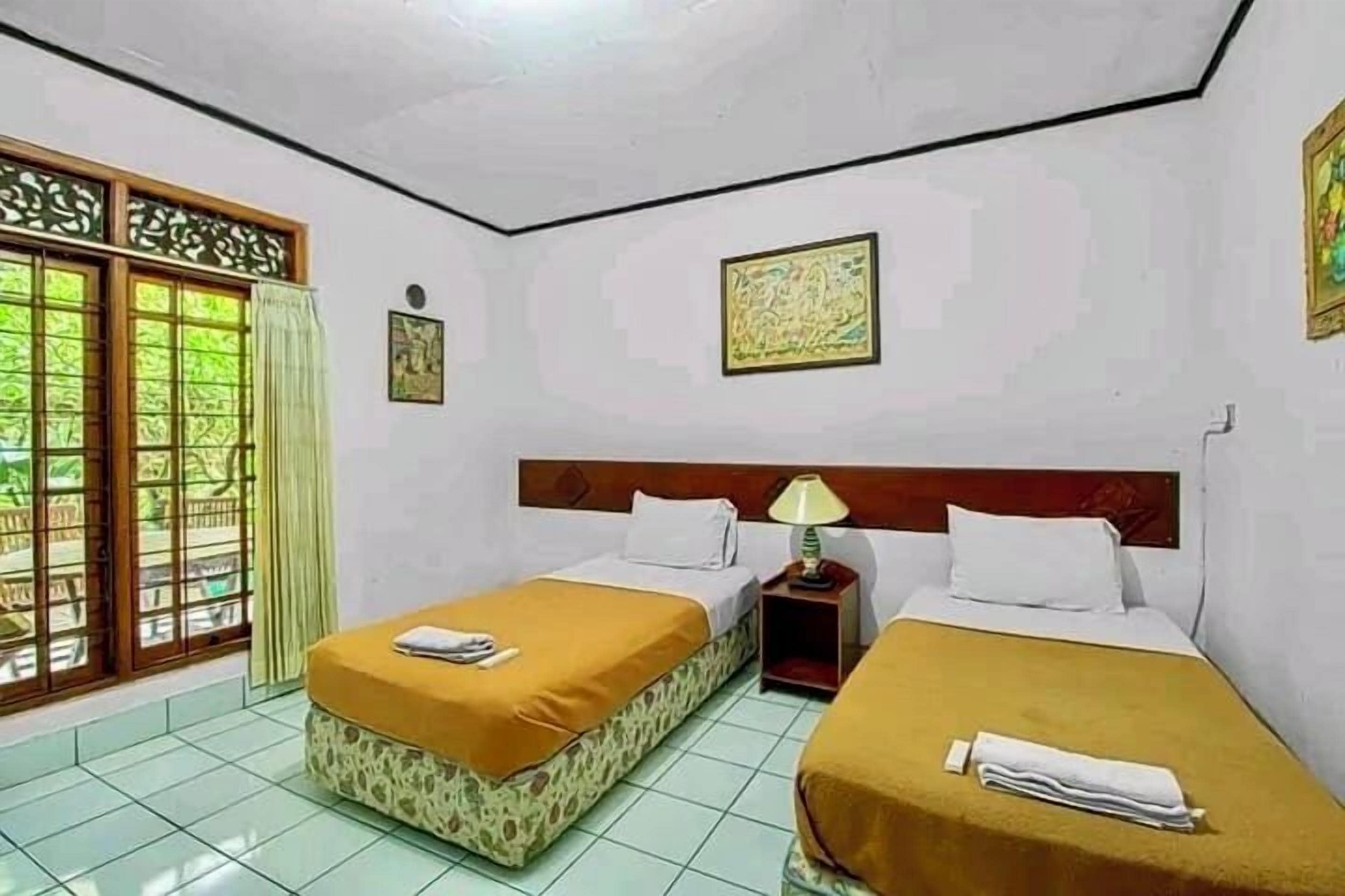 Family Room, Balcony, Garden View | Desk, laptop workspace, free WiFi