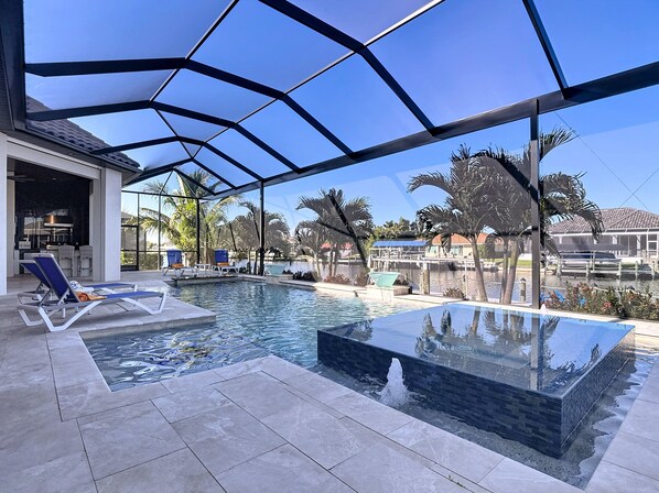 A heated pool - Luxury, Heated Pool & Spa, Outdoor Kitchen, Kayaks, Gulf Access: Sun Seeker's Horizon (Cape Coral)