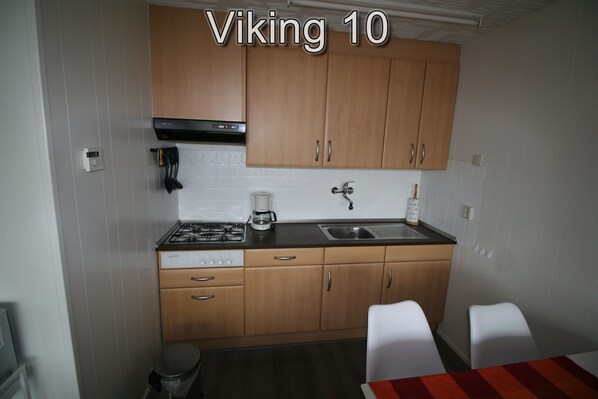 Fridge, stovetop, dishwasher, coffee/tea maker