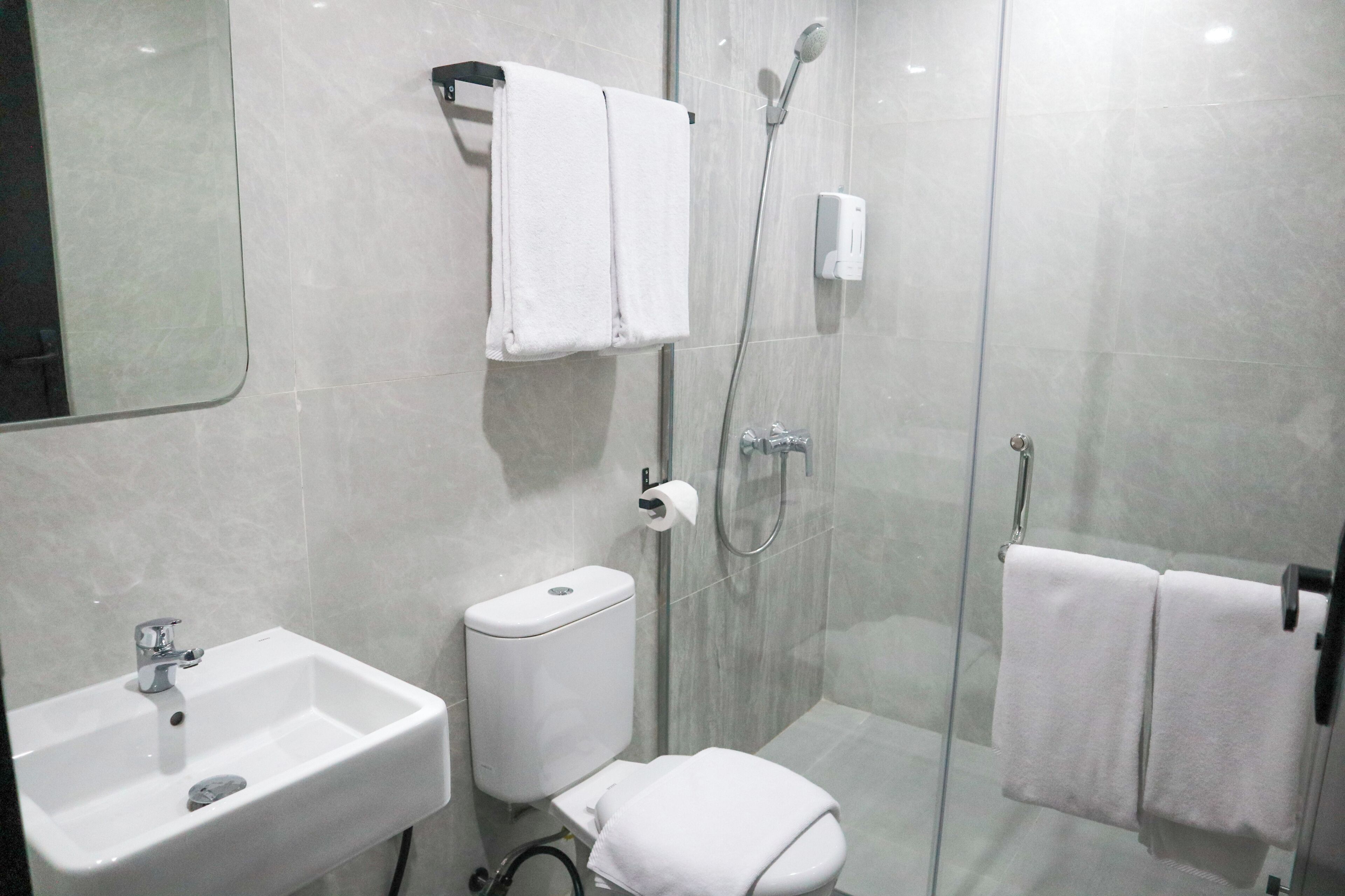 Shower, slippers, towels, soap