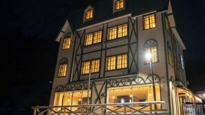A multi-story building with a traditional architectural style, featuring a balcony and multiple windows. - YuiLocalZao (Yamagata)