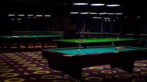 A pool hall with multiple pool tables and a patterned carpet. - Litz Resort Batumi (Batumi)