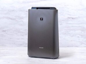 A tall, rectangular air conditioner unit with a metallic finish and a logo on the top. - Sun Hotel Fukuyama (Fukuyama)